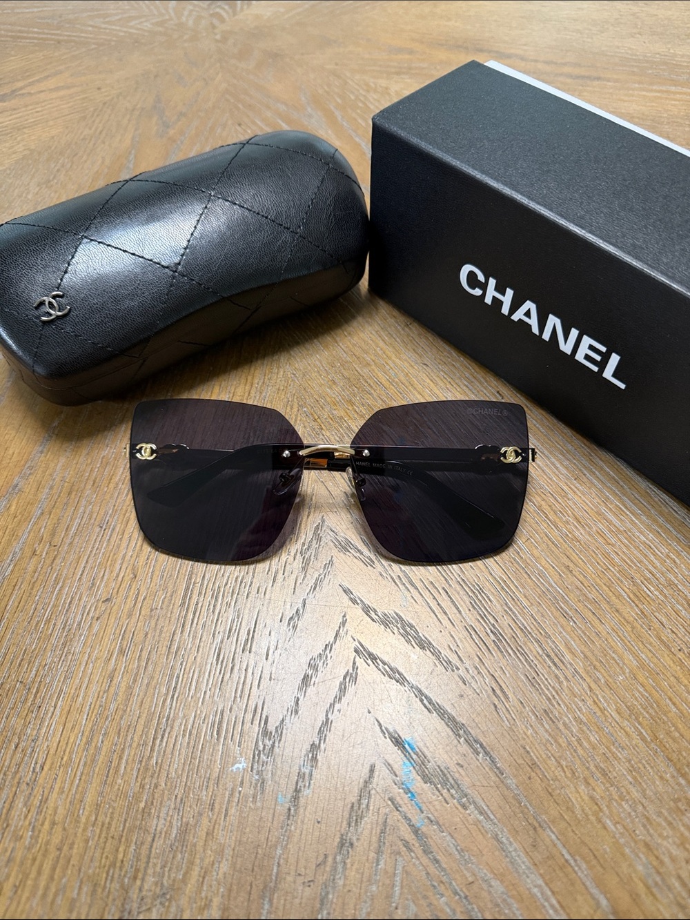 CHANEL Rimless Square Sunglasses in Black and Gold Accent